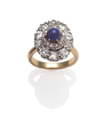 Lot 223 - A Sapphire and Diamond Cluster Ring, the sapphire within a rose cut diamond border and an outer...