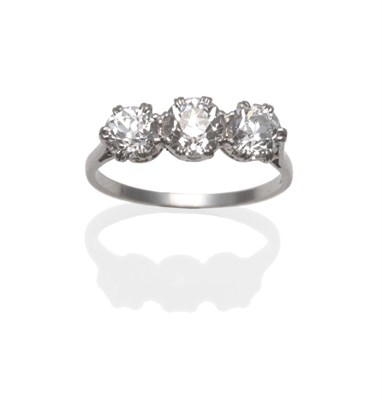 Lot 226 - An Early 20th Century Diamond Three Stone Ring, the old cut diamonds in white split claw...