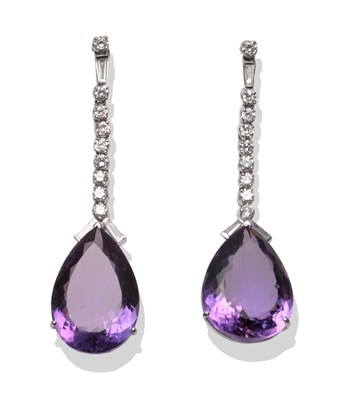 Lot 228 - A Pair of 18 Carat White Gold Amethyst and Diamond Drop Earrings, a row of round brilliant cut...