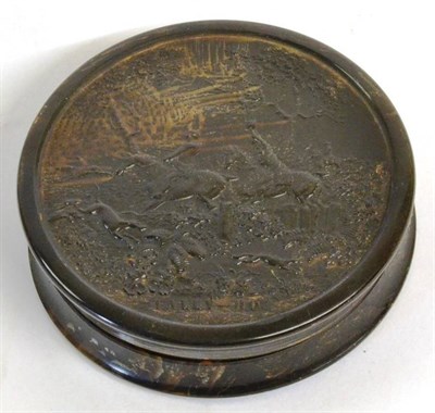 Lot 1078 - A 19th Century Pressed Horn Snuff Box, of circular form, decorated with a hunting scene and...