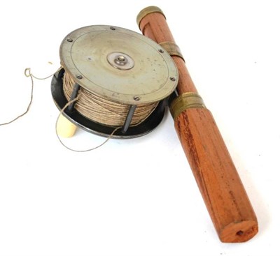 Lot 1111 - A 4in Brass Salmon Reel by J.Graham & Co., Inverness, with fat ivorine handle, line, mounted on...