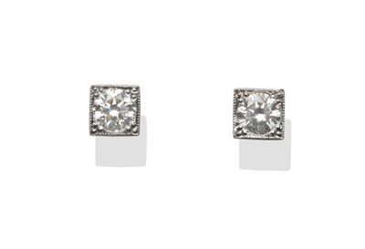 Lot 243 - A Pair of Diamond Solitaire Stud Earrings, the round brilliant cut diamonds in claw settings within
