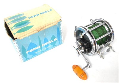 Lot 1217 - A Penn Senator Multiplying Sea Fishing Reel, with chrome body, bakelite ends, faux amber...