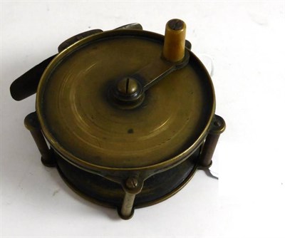 Lot 1229 - A 3 1/2"; Brass Winch, with raised pillars, anti-foul handle, brass foot