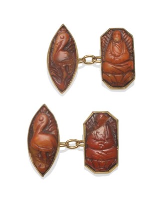 Lot 247 - A Pair of Amber Cufflinks, each with a marquise shaped amber head, carved with a stork, chain...