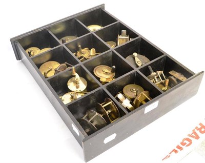 Lot 1239 - A Collection of Twenty Four Brass Reels, including Platewind, Winches etc, in a wooden display case