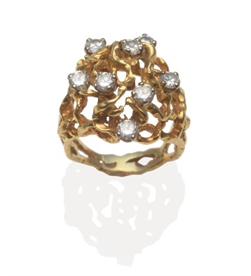 Lot 251 - An 18 Carat Gold Diamond Ring, the textured freeform mount inset with eight round brilliant cut...