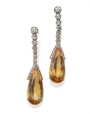 Lot 254 - A Pair of 18 Carat White Gold Citrine and Diamond Drop Earrings, a graduated row of round brilliant