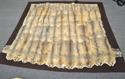 Lot 2044 - A Car Rug, circa 1930, composed of numerous African wild cat skins arranged in four rows, on...