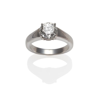Lot 259 - A Diamond Solitaire Ring, the round brilliant cut diamond in a white four claw setting, on a chunky
