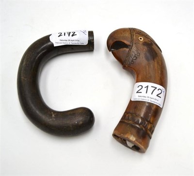 Lot 2172 - An Indonesian Carved Horn Kukri Pommel as a Parrot Head, 19th century, with open beak and bone...