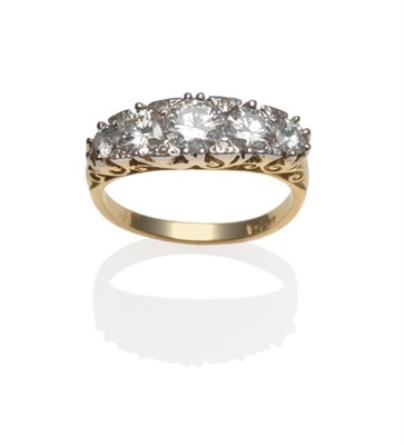 Lot 279 - A Diamond Five Stone Ring, the graduated round brilliant cut diamonds spaced by eight-cut...