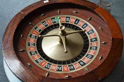 Lot 1007 - A Large French Roulette Wheel by G Caro, Paris, with brass spinner, diameter 80cm