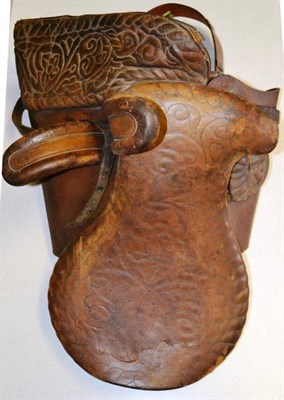 Lot 1057 - A Late 19th/Early 20th Century Leather Side Saddle, the 21cm seat with foliate stitched decoration