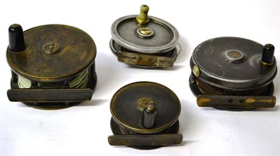 Lot 1100 - Four Platewind Reels - 3 1/2in brass by Wanless Bros, Sunderland & South Shields, 3 1/in alloy reel