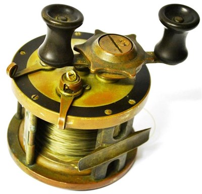 Lot 1175 - A Pfleuger Ebonite and Brass 'Templar' Multplying Sea Reel, with twin ebonite handles, brass...