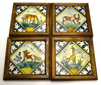 Lot 1219 - A Set of Four Tinglaze Polychrome Animal Tiles, in early 18th century style, depicting Giraffe,...