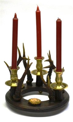 Lot 1227 - A Three-Light Brass, Antler and Wood Candelabrum, modern, as a ring of wood applied with three...