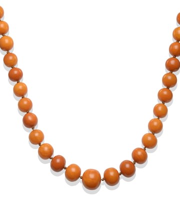 Lot 316 - An Amber Necklace, seventy-one knotted graduated oval beads, of butterscotch colour, length 115cm
