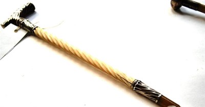 Lot 1310 - A Victorian Ivory, Silver and Rhinoceros Horn Mounted Swagger Stick, London 1889, the fluted T form