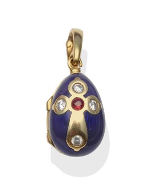Lot 325 - A Modern Fabergé Egg Pendant, a cruciform motif set with a garnet and diamonds, within blue...