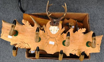 Lot 1378 - An Austro-German Carved Softwood Deer Coat Rack, centred by a pair of antlers on frontlet, with...