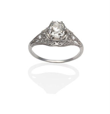 Lot 333 - An Edwardian Style Diamond Ring, an old cut diamond claw set within a foliate mount inset with...