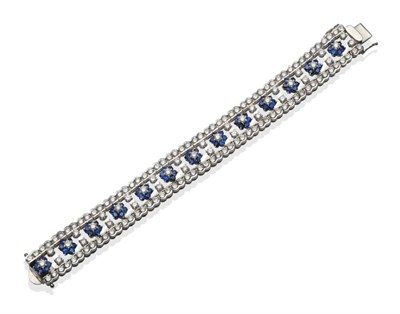 Lot 334 - An 18 Carat White Gold Sapphire and Diamond Floral Bracelet, round brilliant cut diamond and...
