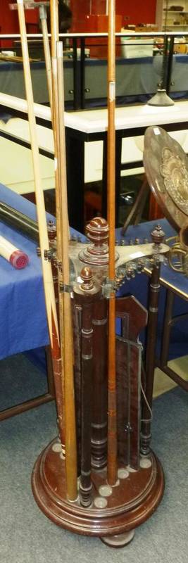 Lot 17 - A Revolving Mahogany Snooker Cue Stand, with circular base raised on bun feet, triform top section