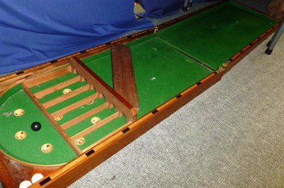 Lot 20 - A Large Folding Mahogany Bagatelle Game, with green baize playing surface, boxwood scoring...