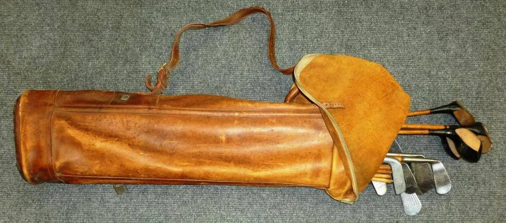 Lot 35 - A Vintage Leather Golf Bag, containing twelve hickory shafted golf clubs, including two...
