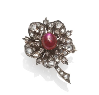Lot 347 - A Victorian Ruby and Diamond Flower Brooch, the oval cabochon ruby within petals set with rose...