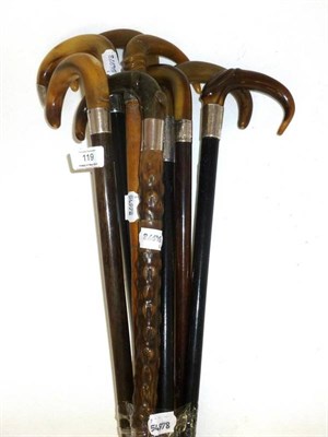 Lot 119 - Eight Horn Handled Walking Sticks, including seven with silver collars, three with ebonised shafts