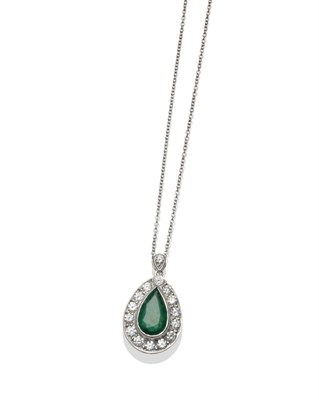 Lot 368 - An Emerald and Diamond Pendant, a pear cut emerald within a border of round brilliant cut...