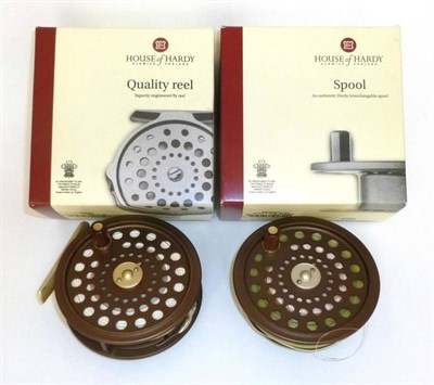 Lot 280 - A Boxed Hardy Golden 'JLH Ultralite No.7' Fly Reel, with nylon case and original box, together with