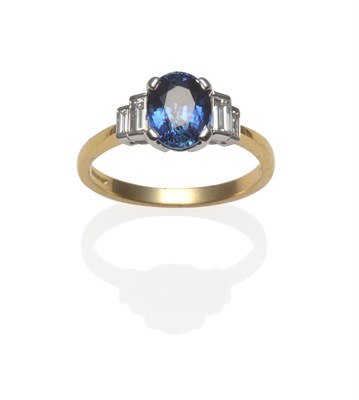 Lot 381 - An 18 Carat Gold Sapphire and Diamond Ring, the oval mixed cut sapphire in white claw settings,...