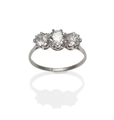 Lot 382 - An Early 20th Century Diamond Three Stone Ring, the graduated old cut diamonds in white claw...