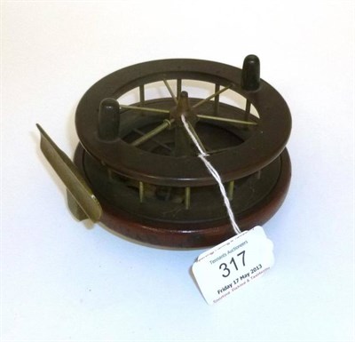 Lot 317 - An Early 4 1/4"; Ebonite and Wood Patented Aerial Type Reel, the six spoked ebonite drum with...