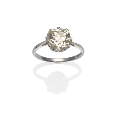 Lot 388 - A Diamond Solitaire Ring, the old cushion shaped diamond in white split claw settings on a...