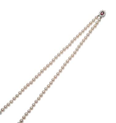 Lot 394 - A Cultured Pearl Necklace, two rows of 52:56 cultured pearls knotted to a ruby and diamond...