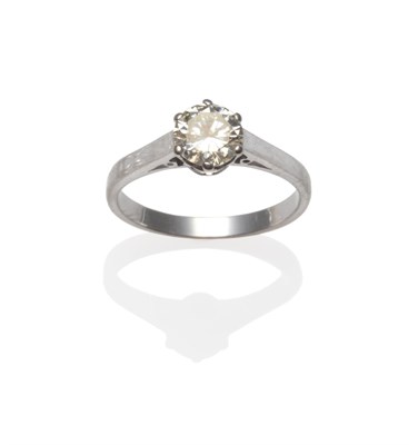 Lot 395 - A Diamond Solitaire Ring, the round brilliant cut diamond in a white claw setting, total...