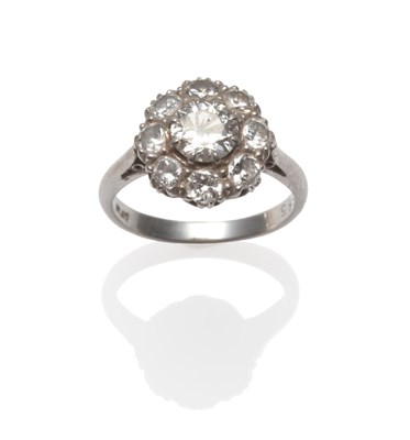 Lot 396 - A Diamond Cluster Ring, the old brilliant cut diamonds in white claw settings, on a tapered...