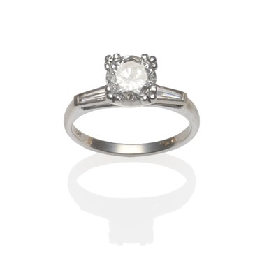 Lot 404 - A Diamond Solitaire Ring, a round brilliant cut diamond in a white corner claw setting, a...