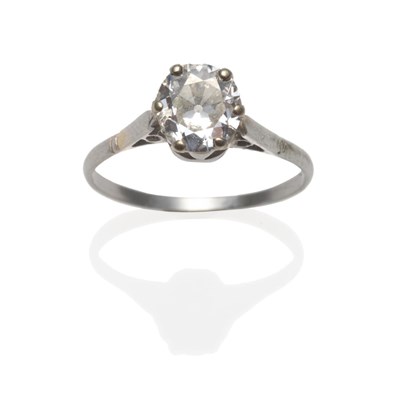 Lot 406 - A Diamond Solitaire Ring, the old cut diamond in a white six claw setting, to pointed shoulders...