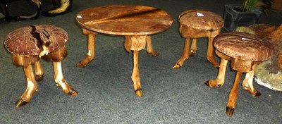 Lot 623 - A Set of Game Skin Covered Table and Three Stools, the table 42cm high, 60cm wide, the stools...