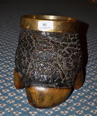 Lot 86 - A Rhinoceros Foot Wine Cooler, circa 1900, with brass rim and liner, 20cm high  CITES Appendix...