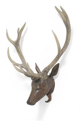 Lot 94 - An Austro-German Carved Walnut Red Deer Head, 18th/19th century, with faux 11 point antlers,...