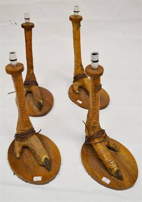 Lot 112 - A Set of Four Ostrich Foot Lamp Bases, South African circa 1960, with wooden plateaux, each...