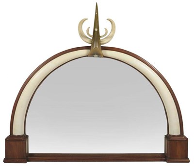 Lot 147 - A Carved Elephant Ivory, Rhinoceros Horn and Warthog Tusk Mounted Overmantel Mirror, circa...