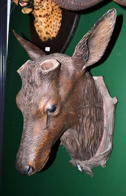 Lot 156 - A German Deer Head Wall Ornament, moulded composition, currently lacking antlers, on rustic...